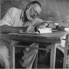 Earnest Hemingway writing.