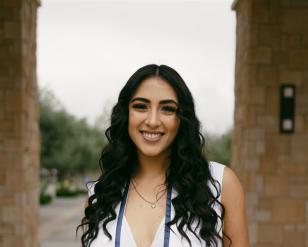 Woman wearing a graduate stole.