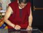 Man measuring for the outline of the mandala.